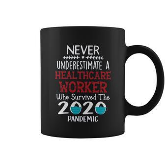 Never Underestimate Who Survived The Pandemic Healthcare Worker Coffee Mug | Favorety DE