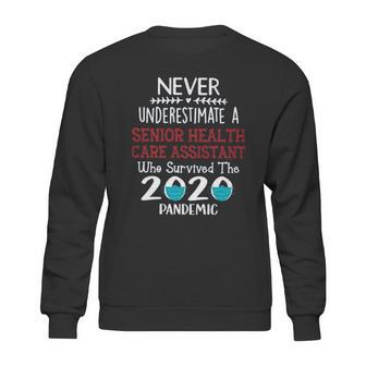 Never Underestimate Who Survived The Pandemic Senior Health Care Assistant Sweatshirt | Favorety AU