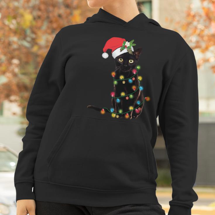 Santa Black Cat Tangled Up In Christmas Tree Lights Holiday Long Sleeve Tshirt Women Hoodie Gifts for Women