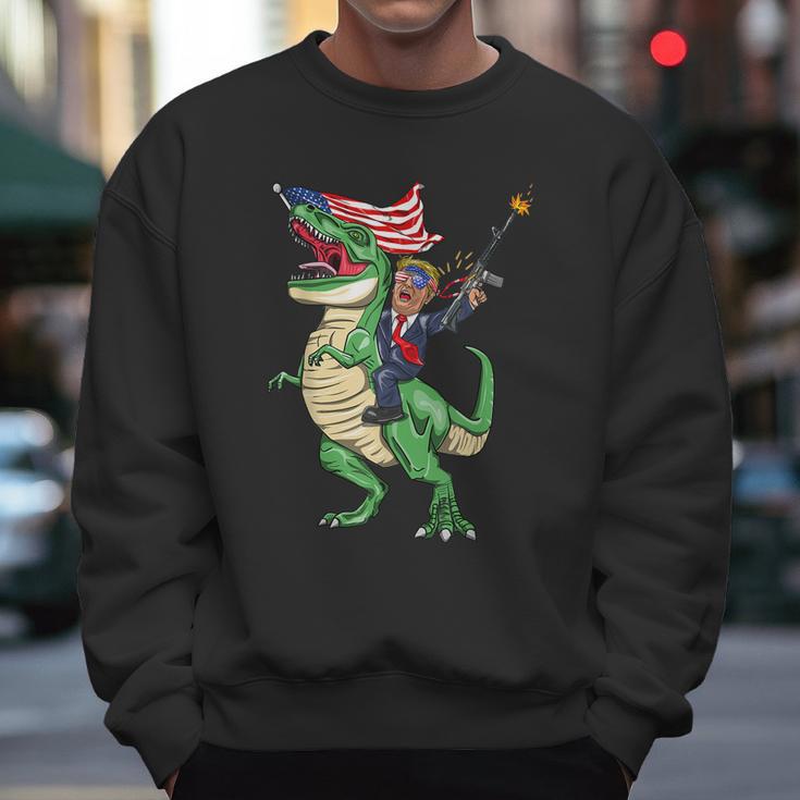 Machine Gun Trump On Rex Dinosaur With American Flag Graphic Design Printed Casual Daily Basic Men Sweatshirt