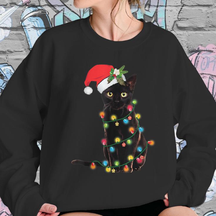 Santa Black Cat Tangled Up In Christmas Tree Lights Holiday Tshirt Women Sweatshirt Gifts for Her