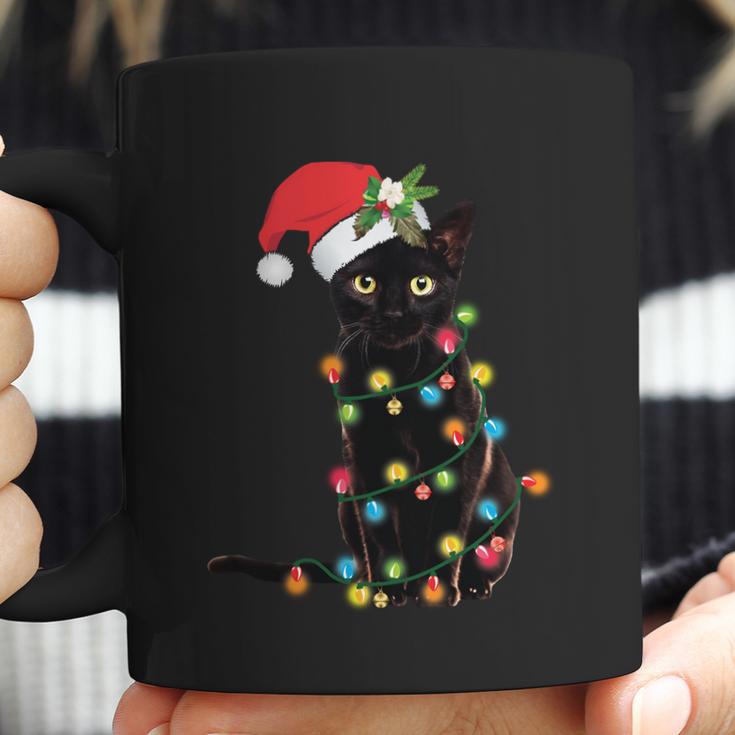 Santa Black Cat Tangled Up In Christmas Tree Lights Holiday Long Sleeve Tshirt Coffee Mug