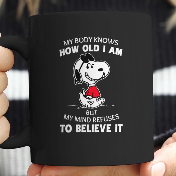 Snoopy My Body Knows How Old I Am But My Mind Refuses To Believe It Shirt Coffee Mug