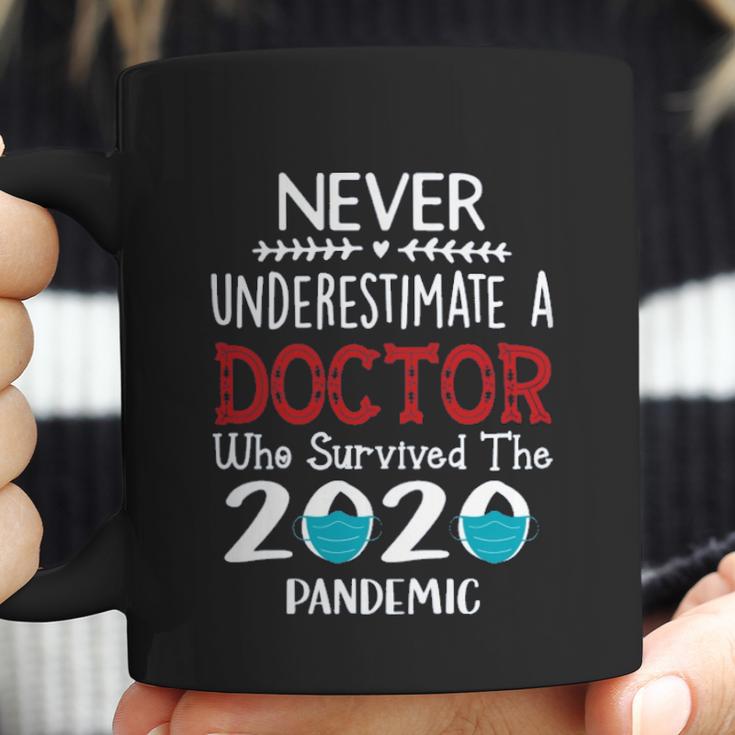 Never Underestimate Who Survived The Pandemic Doctor Coffee Mug