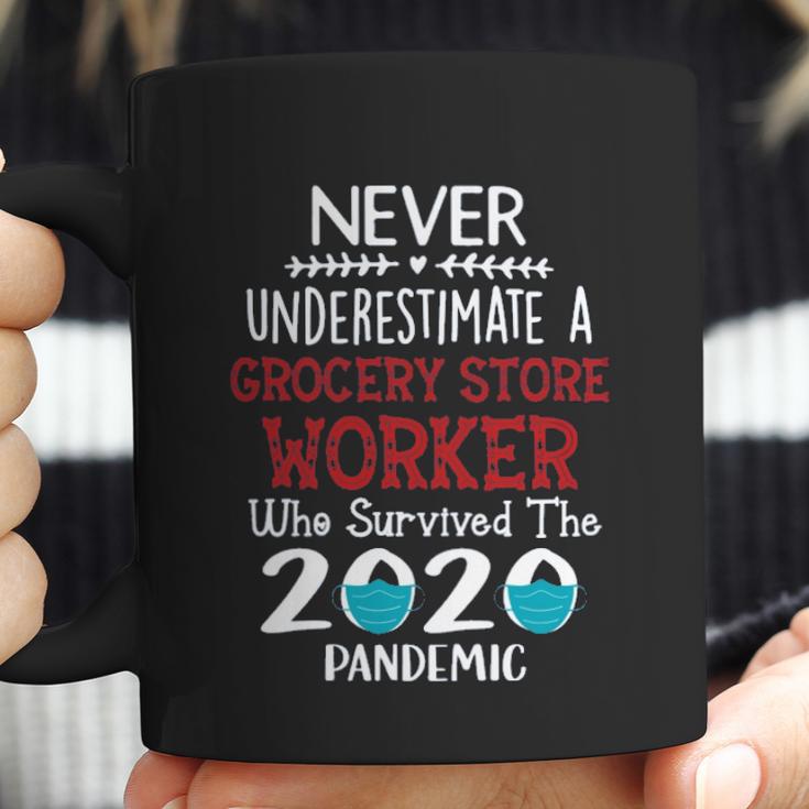 Never Underestimate Who Survived The Pandemic Grocery Store Worker Coffee Mug