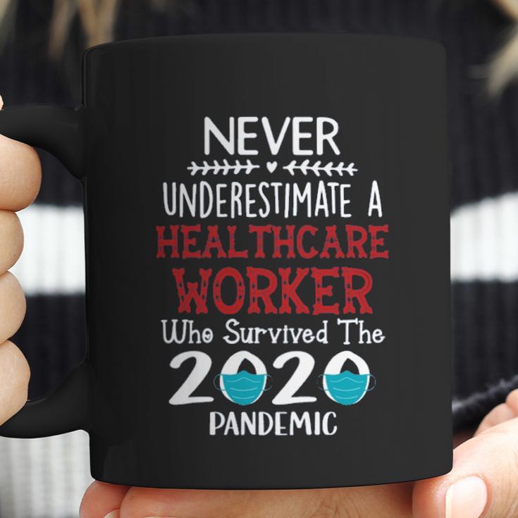 Never Underestimate Who Survived The Pandemic Healthcare Worker Coffee Mug