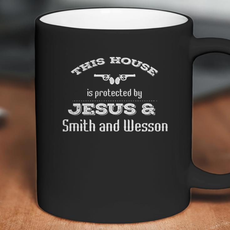 This House Is Protected By Jesus & Smith And Wesson Coffee Mug