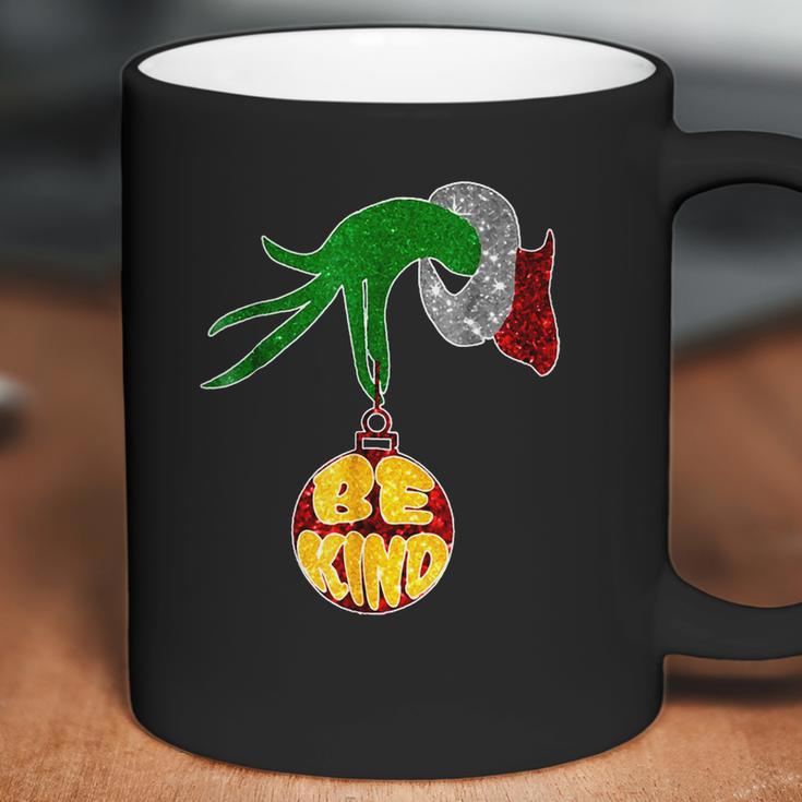 Be Kind Grinch Hand Holding Coffee Mug