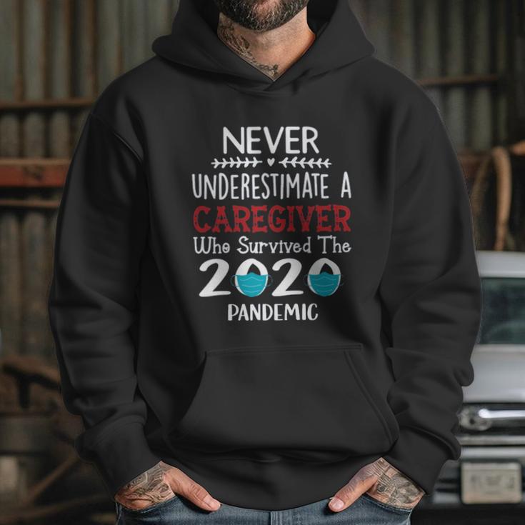 Never Underestimate Who Survived The Pandemic Caregiver Hoodie Gifts for Her