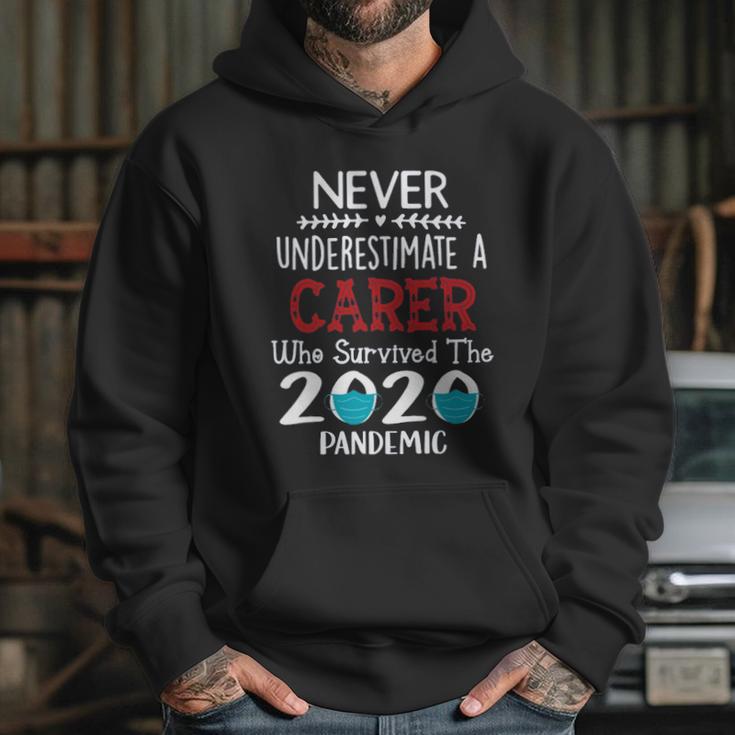 Never Underestimate Who Survived The Pandemic Carer Hoodie Gifts for Her