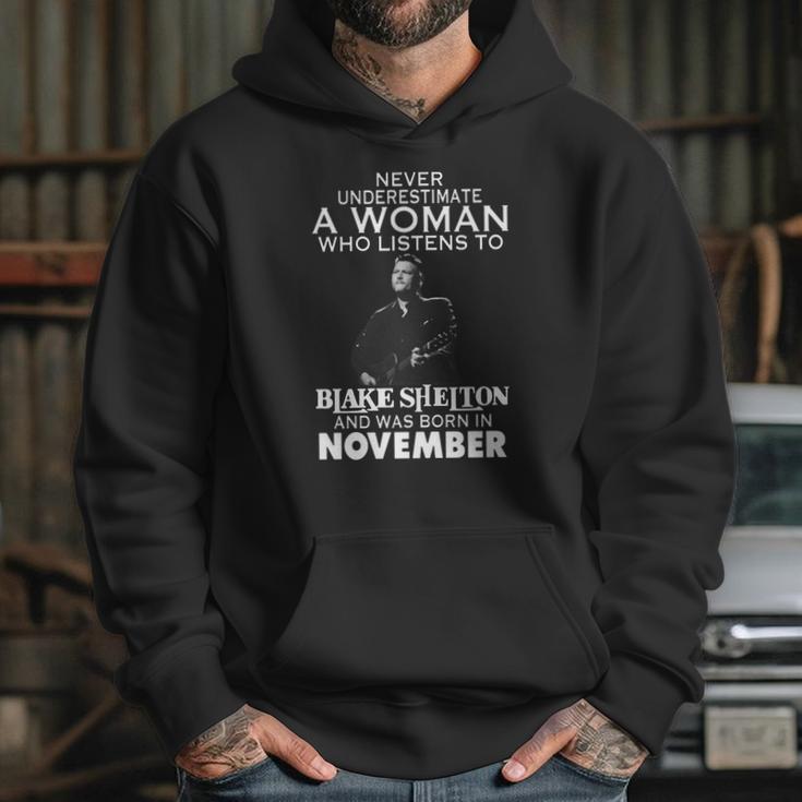 Never Underestimate A Woman Who Listens To Blake Shelton And Was Born In November Shirt Hoodie Sweater Longsleeve T-Shirt Hoodie Gifts for Her