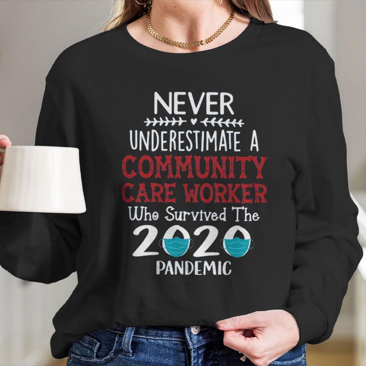 Never Underestimate Who Survived The Pandemic Community Care Worker Long Sleeve T-Shirt Gifts for Her