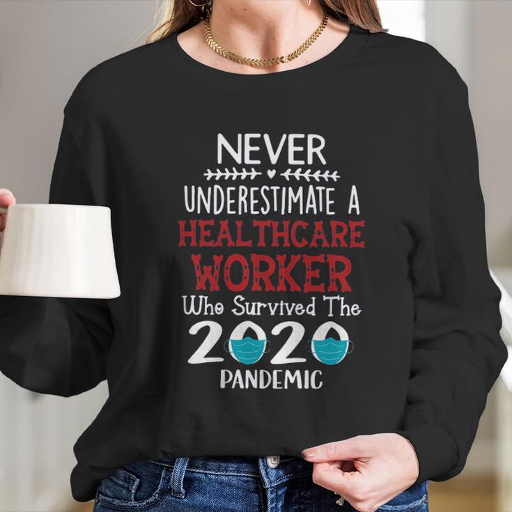 Never Underestimate Who Survived The Pandemic Healthcare Worker Long Sleeve T-Shirt Gifts for Her