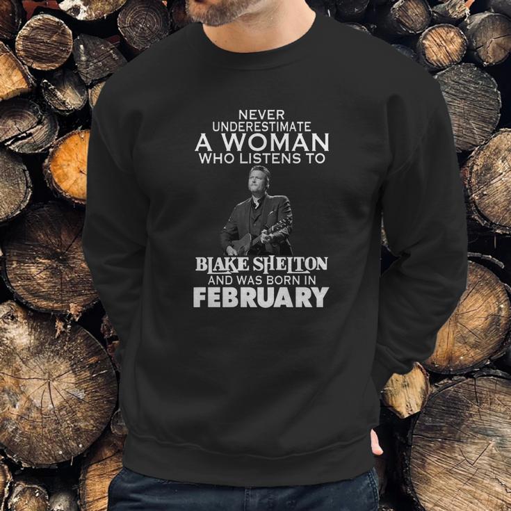 Never Underestimate A Woman Who Listens To Blake Shelton And Was Born In February Shirt Hoodie Sweater Longsleeve T-Shirt Sweatshirt Gifts for Him