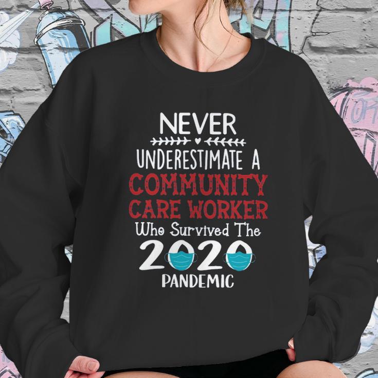 Never Underestimate Who Survived The Pandemic Community Care Worker Sweatshirt Gifts for Her